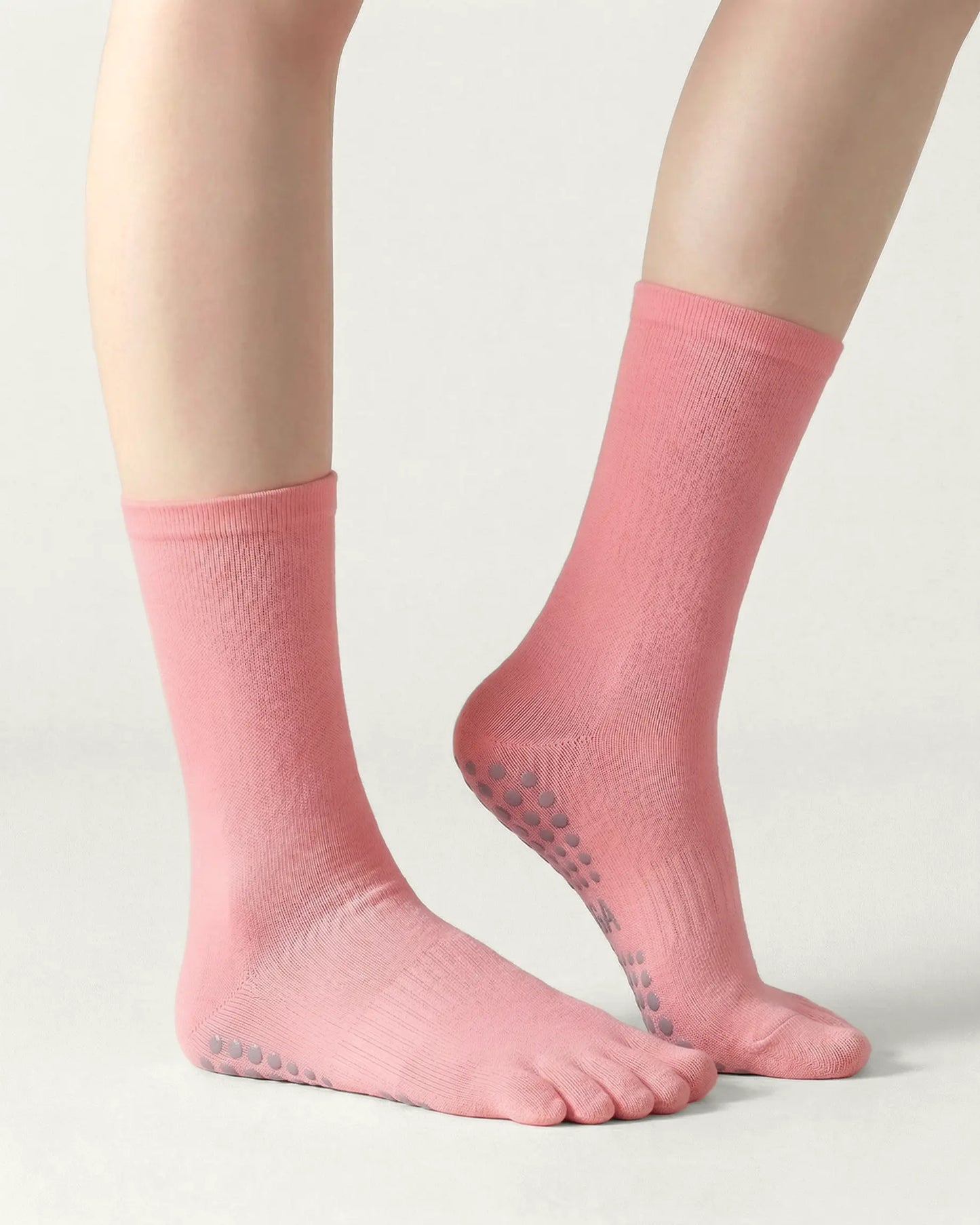 pink | 01 | Pink minimal five-toe grip socks side lift view showing clean texture, toe separation, and minimal studio look