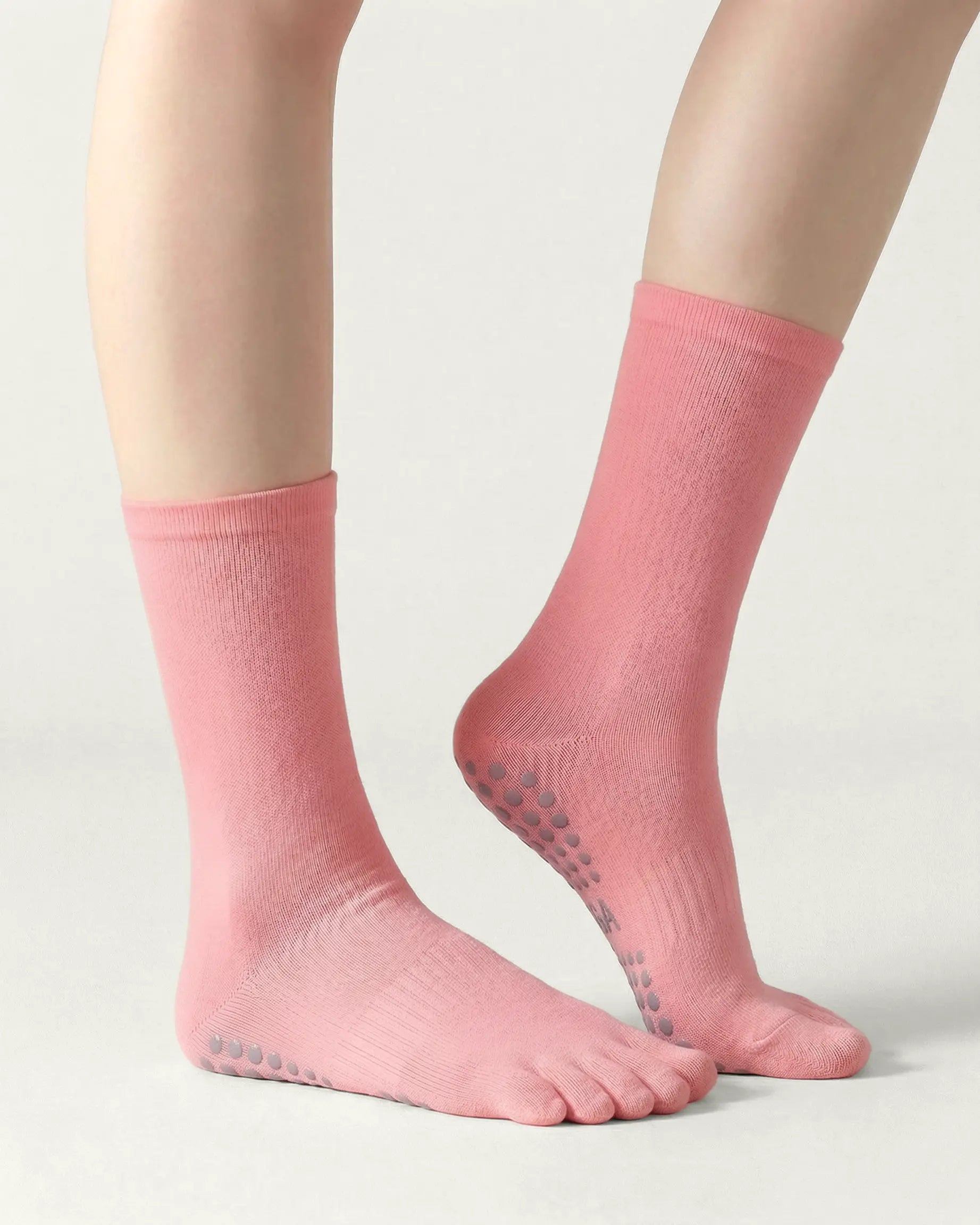 pink | 01 | Pink minimal five-toe grip socks side lift view showing clean texture, toe separation, and minimal studio look