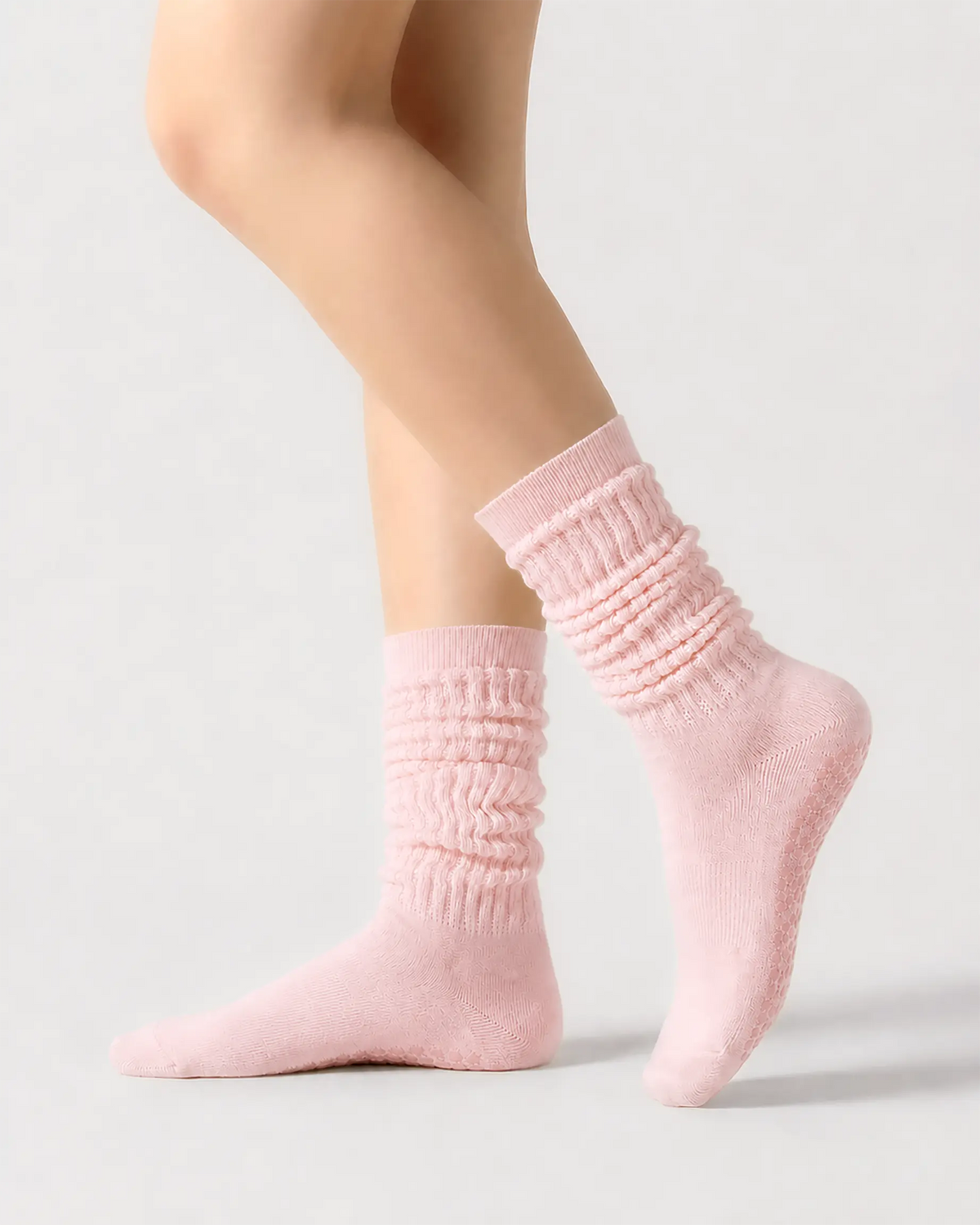 pink | 01 | Pink slouch grip socks side slouch standing view showing relaxed ribbed texture, crew length, and soft studio styling