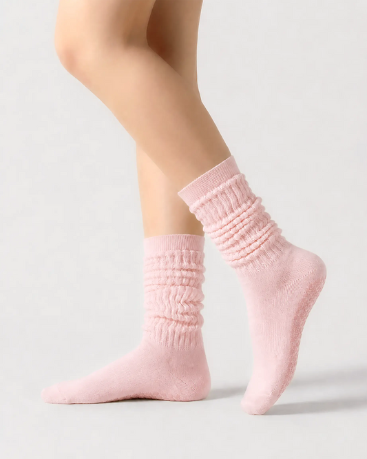 pink | 01 | Pink slouch grip socks side slouch standing view showing relaxed ribbed texture, crew length, and soft studio styling