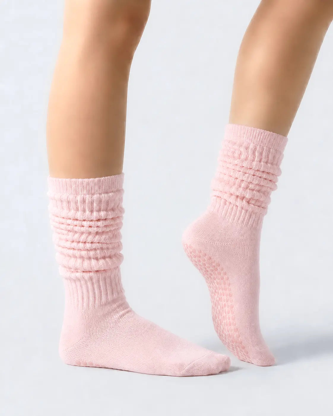 pink | 03 | Pink slouch grip socks side standing view showing relaxed slouch fit, ribbed knit texture, and minimal studio look