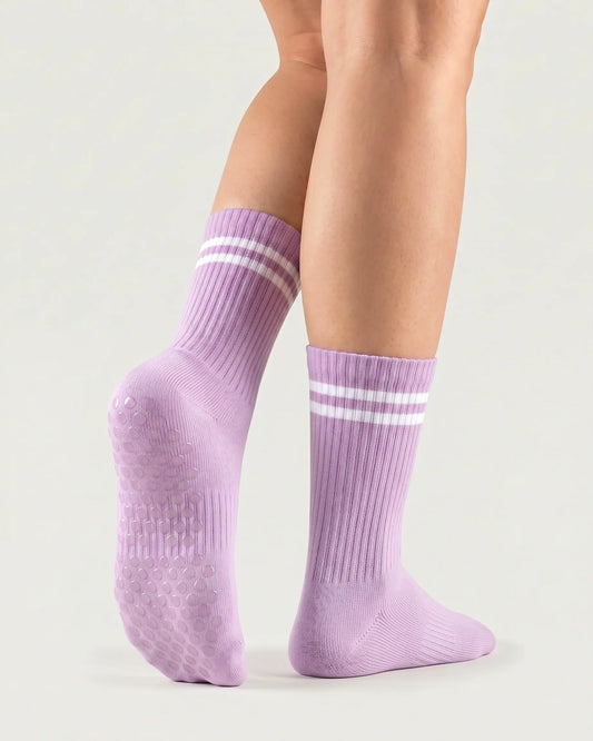 purple | 02 | Purple double-stripe crew grip socks back view showing sole grip pattern, ribbed knit texture, and stripe detail