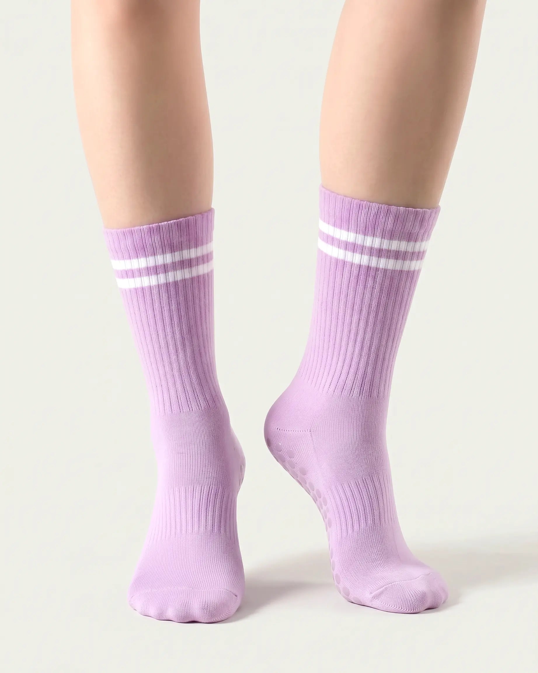 purple | 04 | Purple double-stripe crew grip socks front angled view showing ribbed texture, stripe detail, and crew height