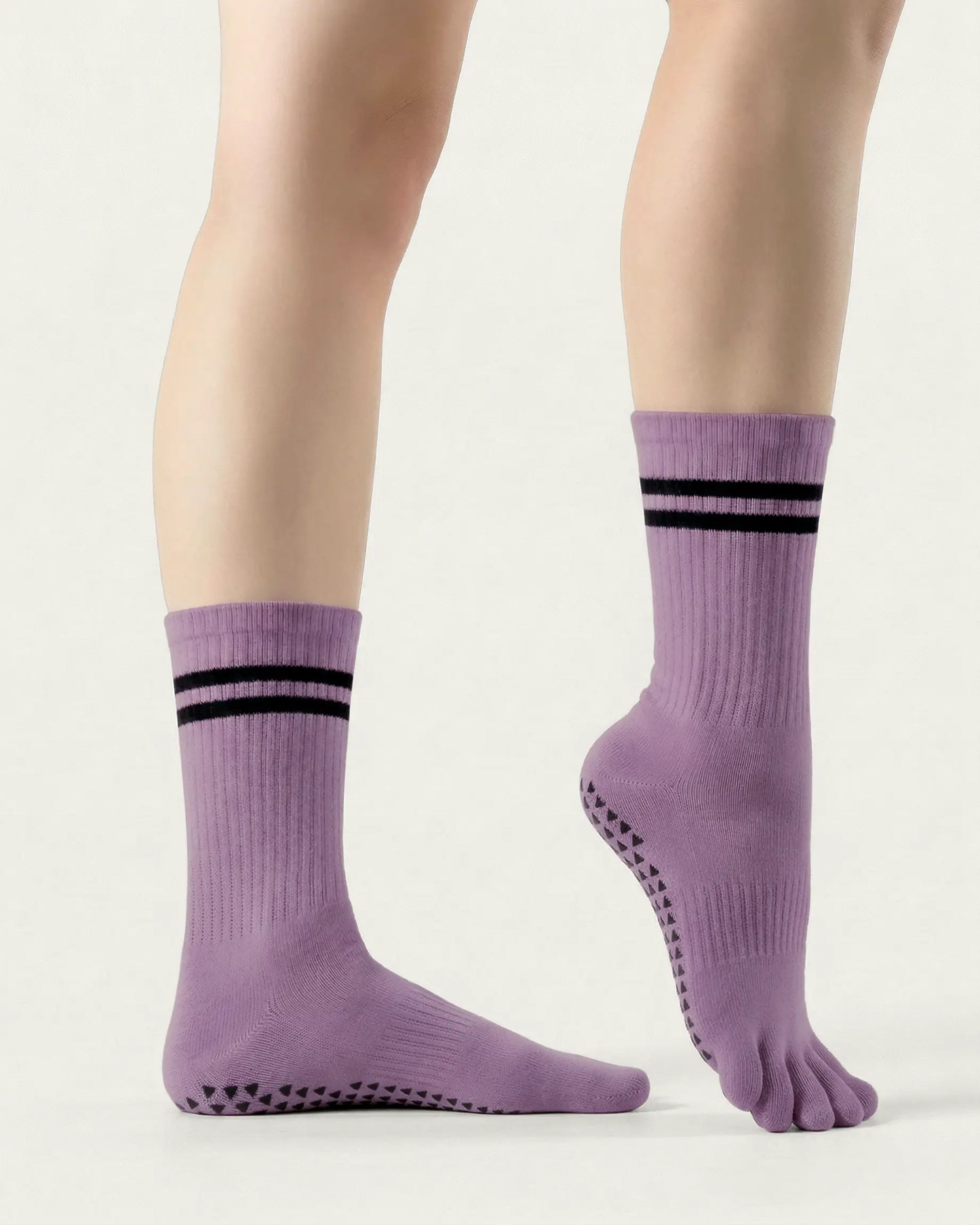 purple | 03 | Purple double-stripe five-toe grip socks side standing view showing ribbed texture, stripe detail, and five-toe silhouette