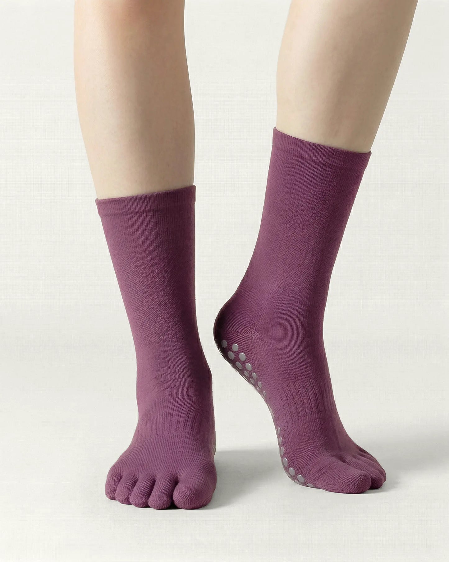 purple | 04 | Purple minimal five-toe grip socks front standing view showing toe separation, grip sole detail, and minimal silhouette