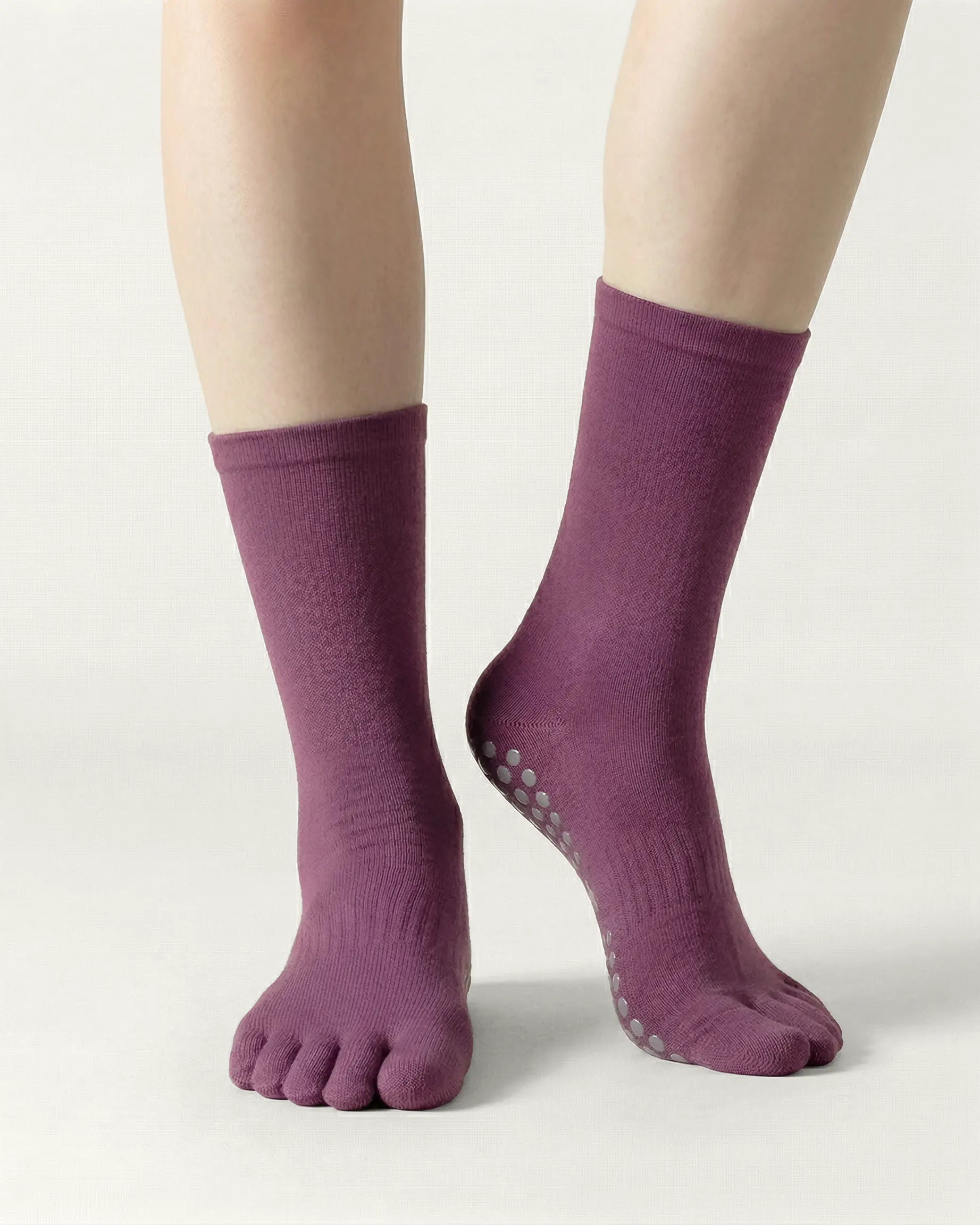 purple | 04 | Purple minimal five-toe grip socks front standing view showing toe separation, grip sole detail, and minimal silhouette