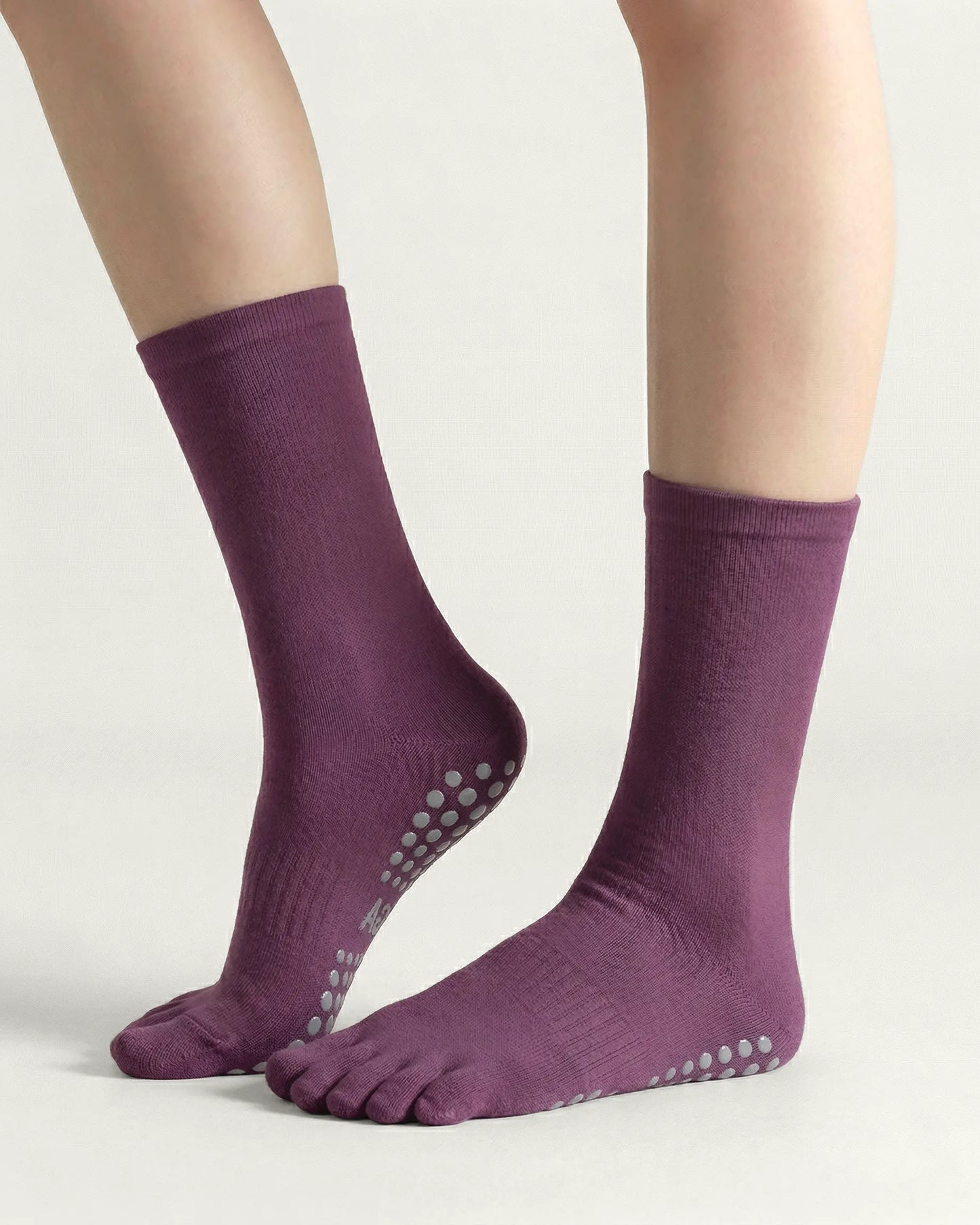 purple | 01 | Purple minimal five-toe grip socks side lift view showing clean texture, toe separation, and minimal studio look