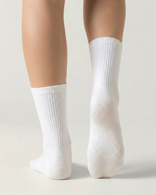 white | 02 | White crew grip socks back view showing sole grip pattern and ribbed knit texture