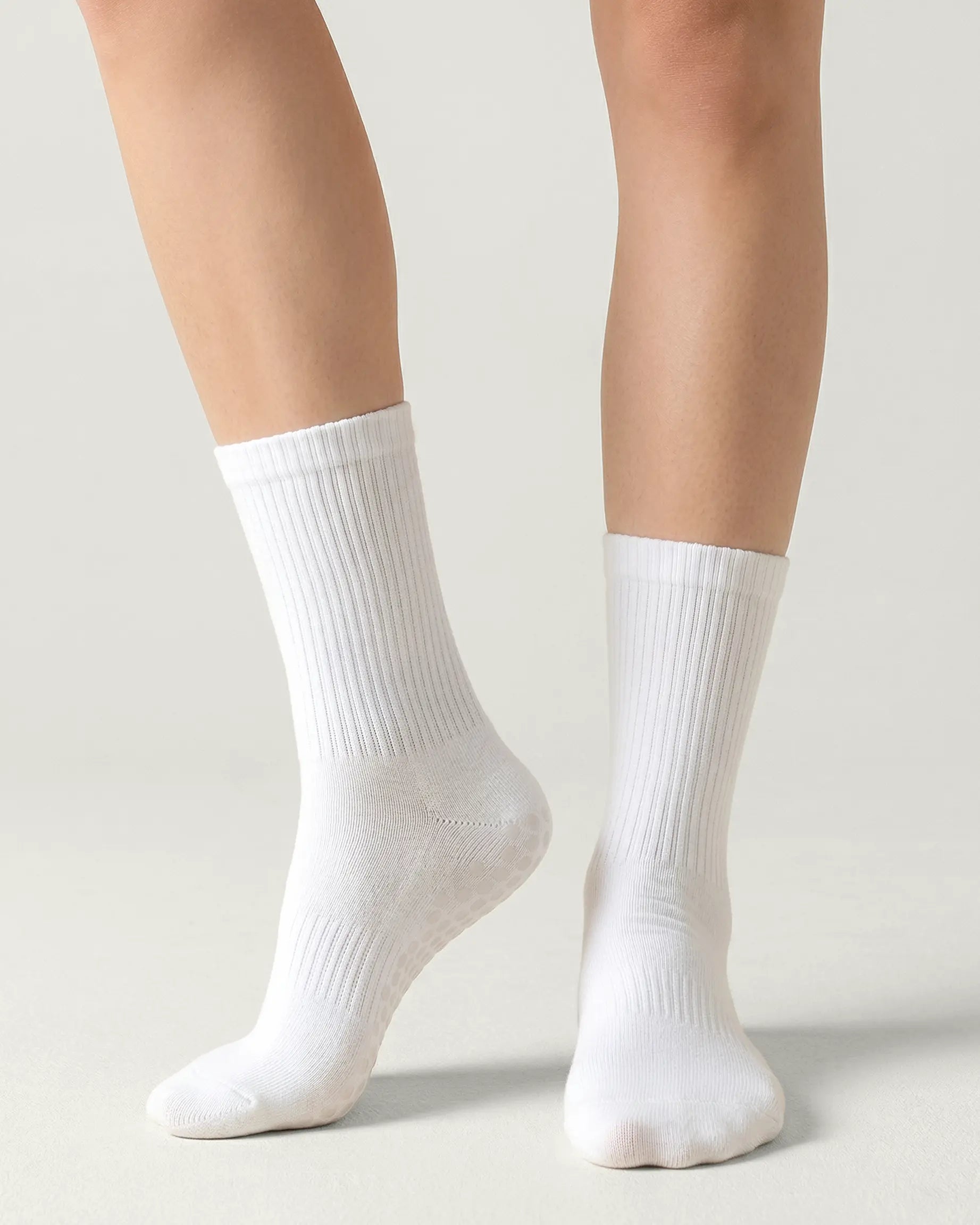 white | 04 | White crew grip socks front angled view showing ribbed texture and crew height
