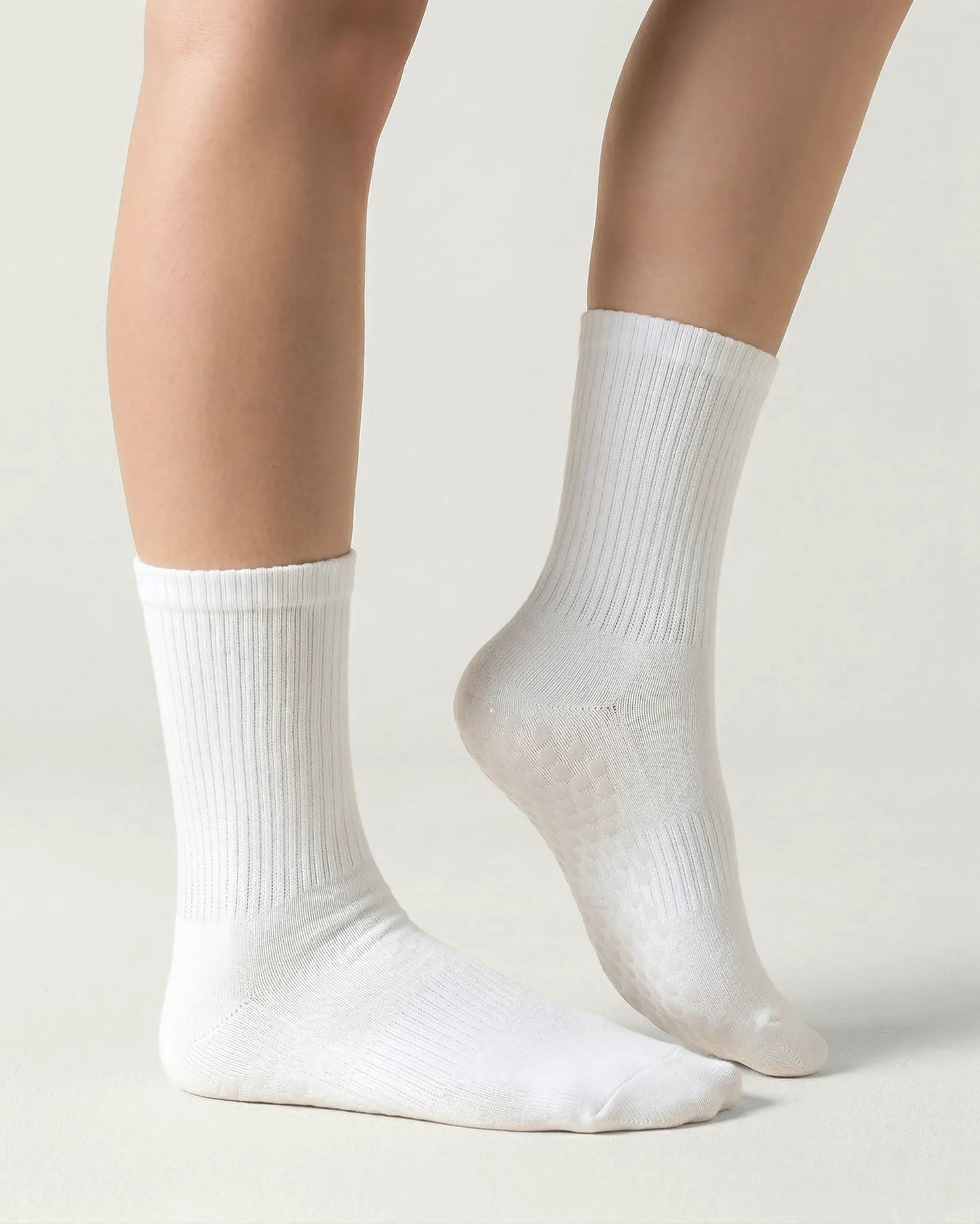 white | 03 | White crew grip socks side standing view showing clean silhouette and crew fit