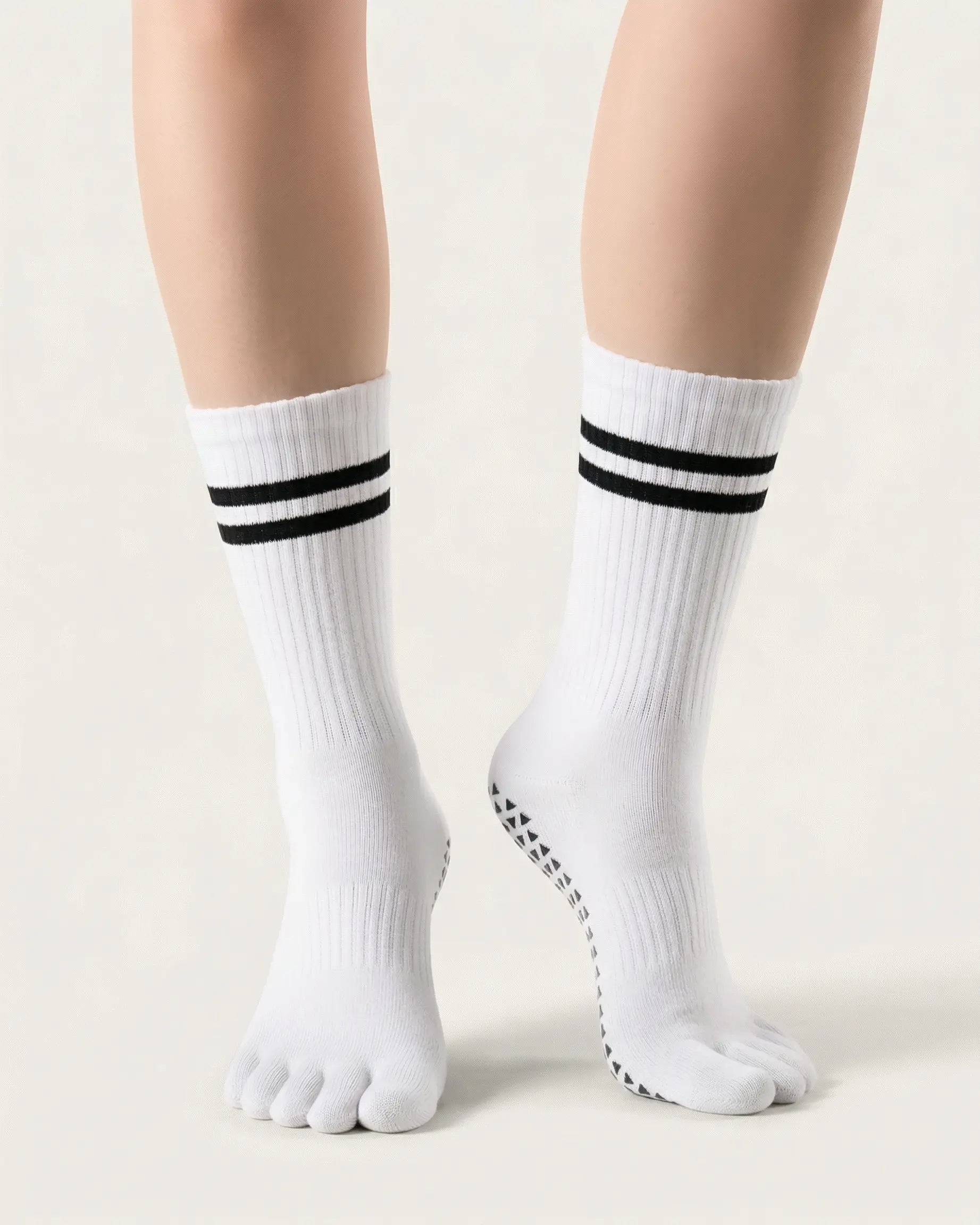 white | 04 | White double-stripe five-toe grip socks front standing view showing stripe detail, toe separation, and overall fit
