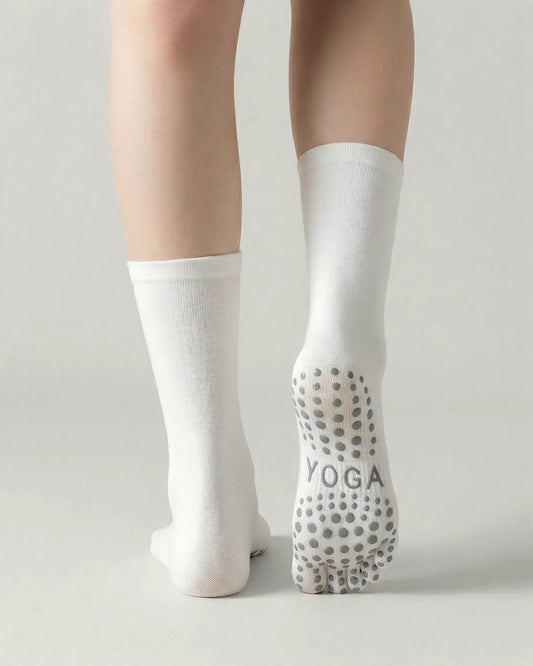 white | 02 | White minimal five-toe grip socks back view showing sole grip pattern, toe separation, and clean silhouette