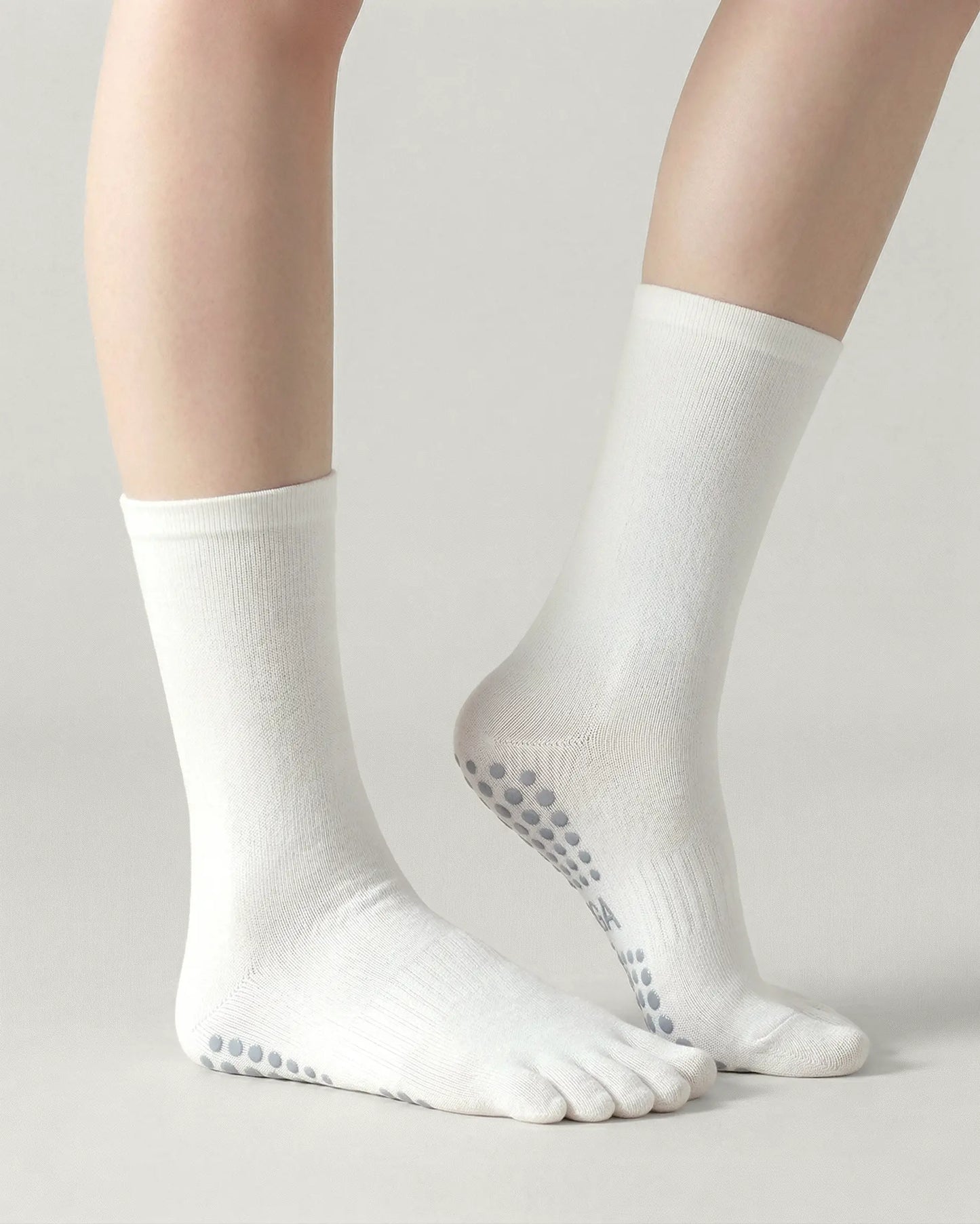 white | 01 | White minimal five-toe grip socks side lift view showing clean texture, toe separation, and minimal studio look