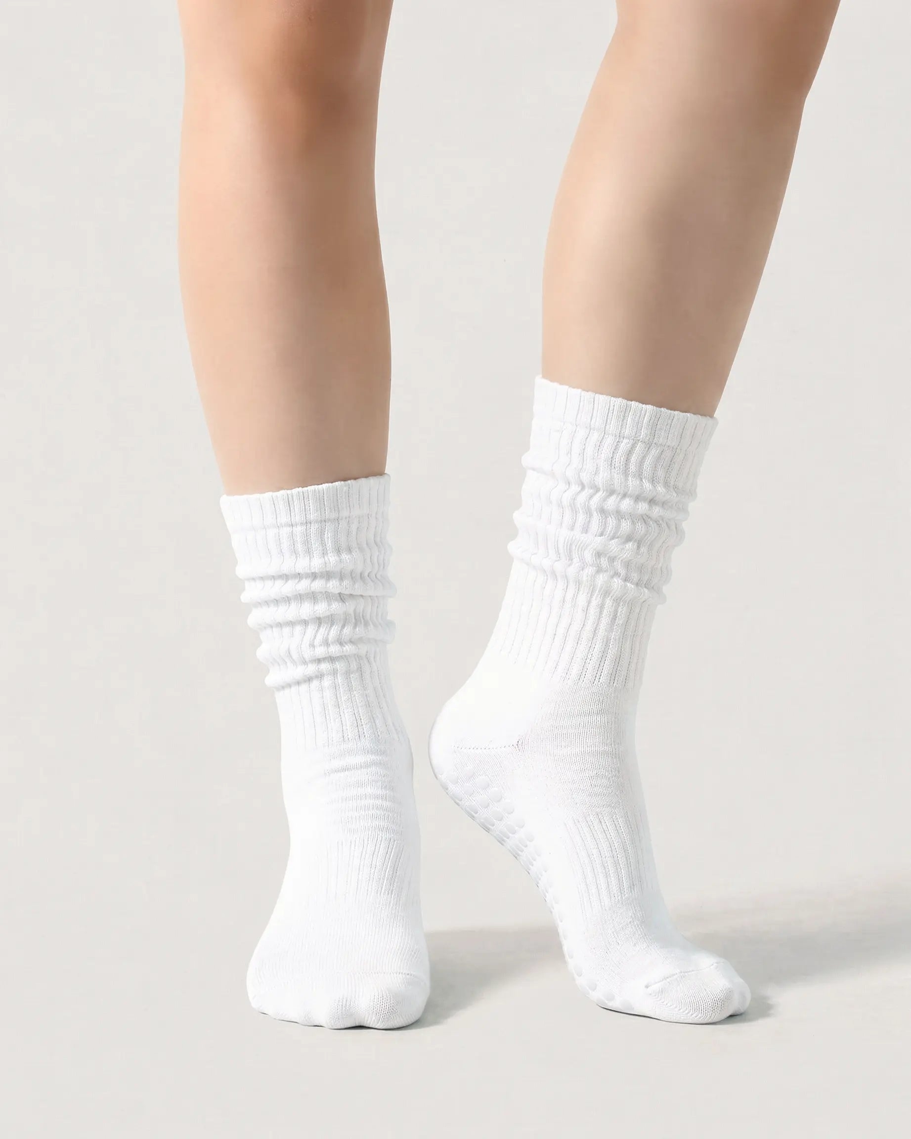 white | 04 | White slouch grip socks front standing view showing crew height, relaxed slouch silhouette, and clean non-slip studio sock styling