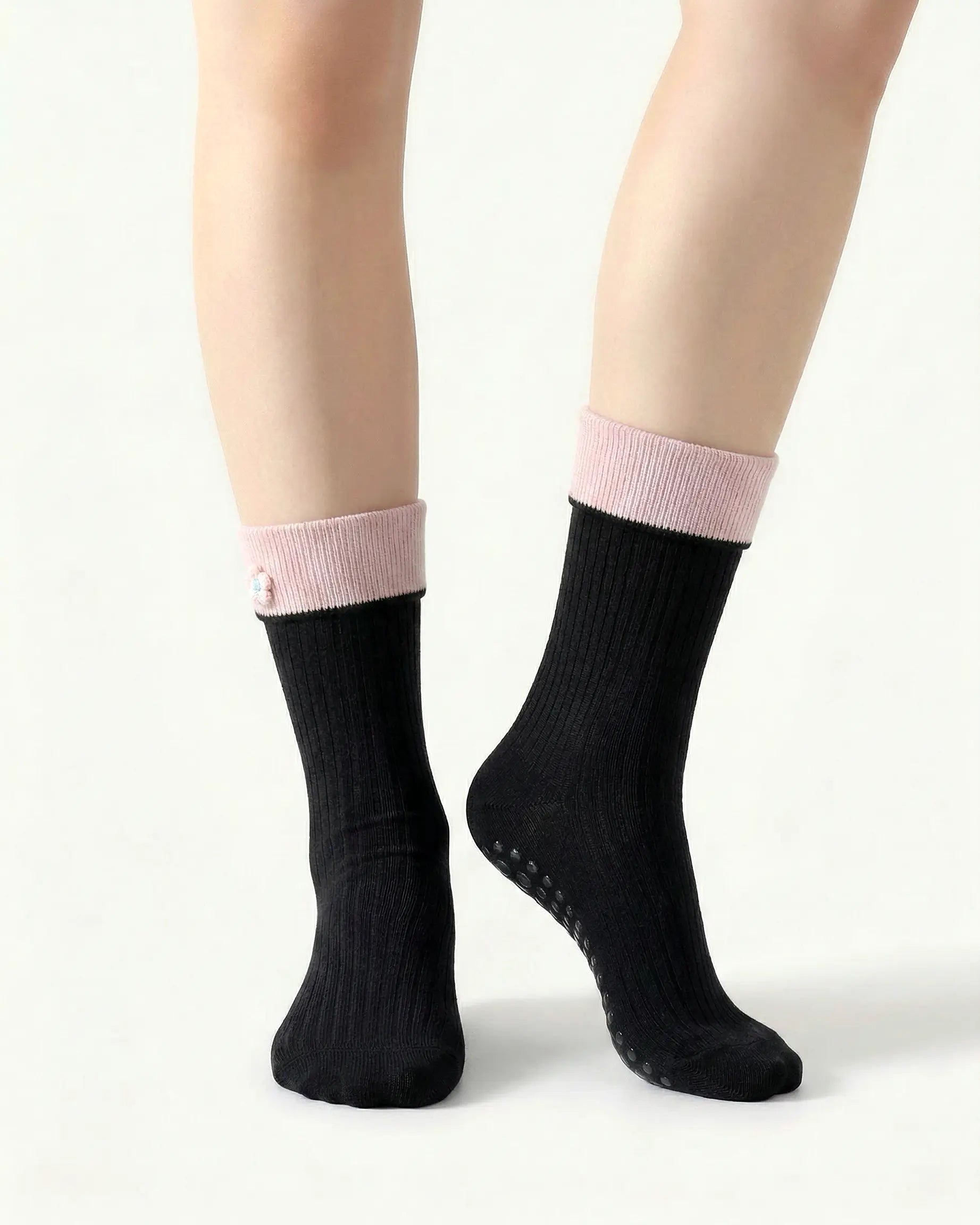 black | 04 | Black floral detail crew grip socks front standing view showing clean crew shape, contrast cuff, and minimal non-slip sock styling