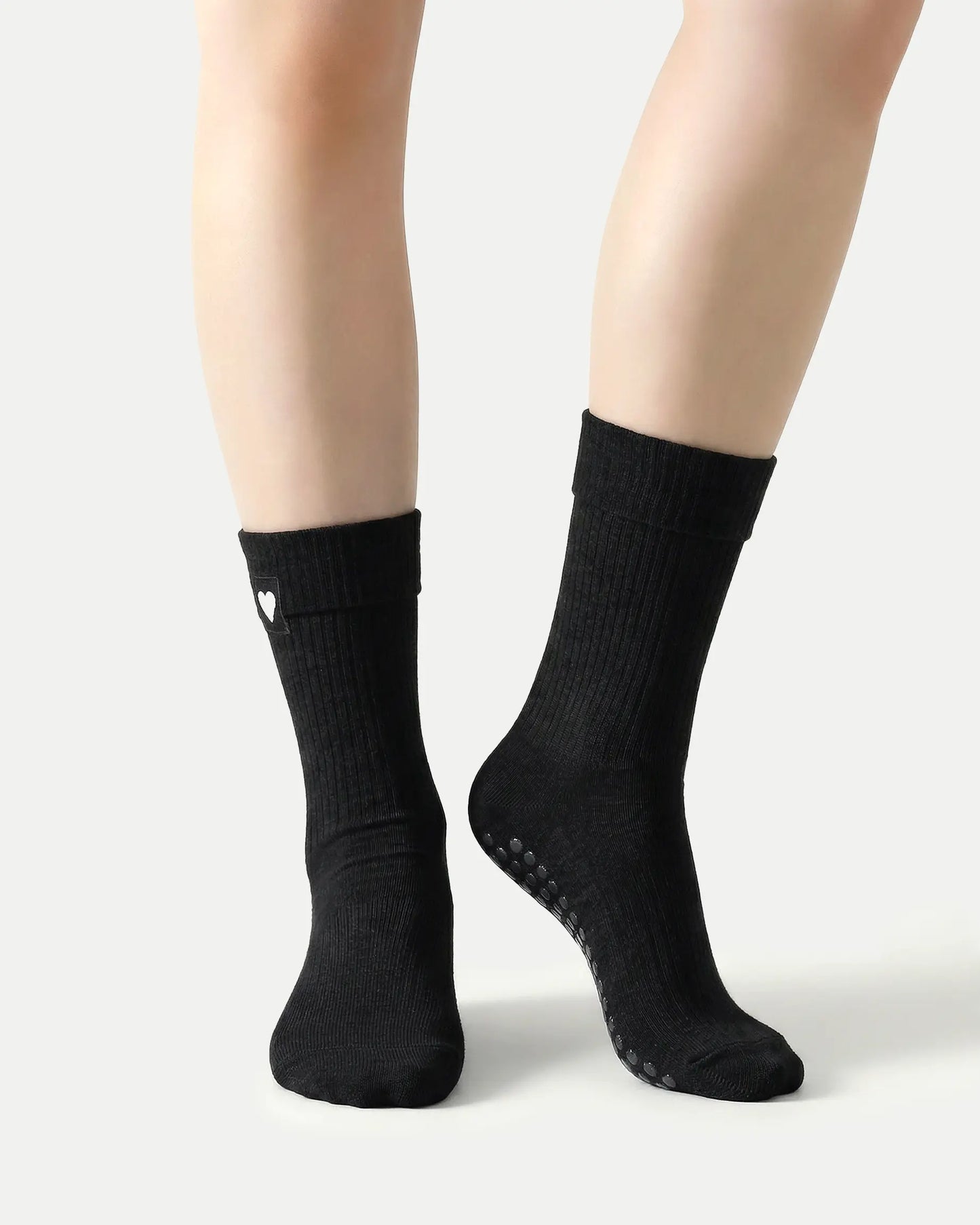 black | 04 | Black heart detail crew grip socks front standing view showing fold-over cuff, black heart embroidery, and clean non-slip crew sock silhouette