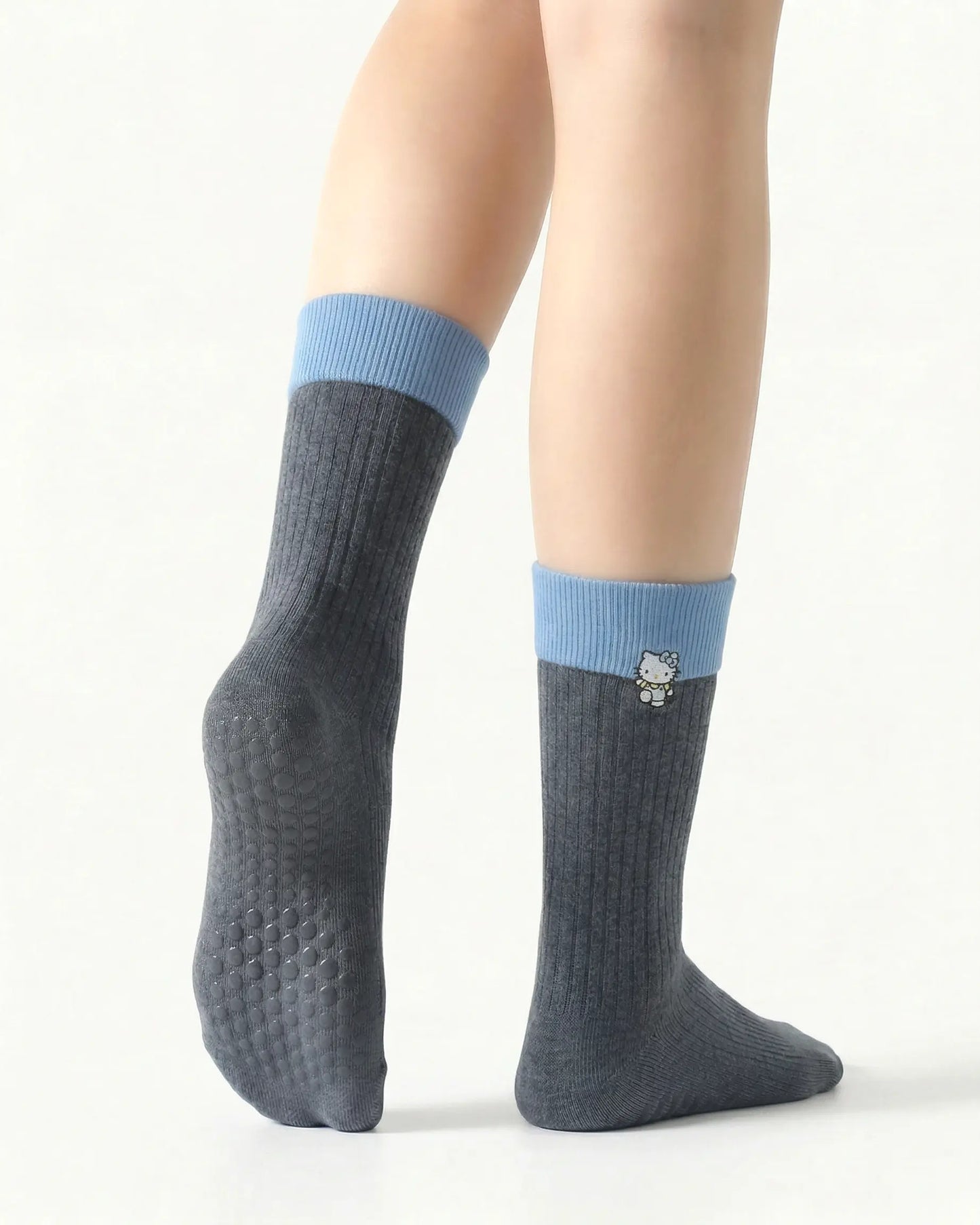 dark-grey | 02 | Dark grey character embroidery crew grip socks back side view showing grip sole detail, contrast black cuff, and embroidered cat motif