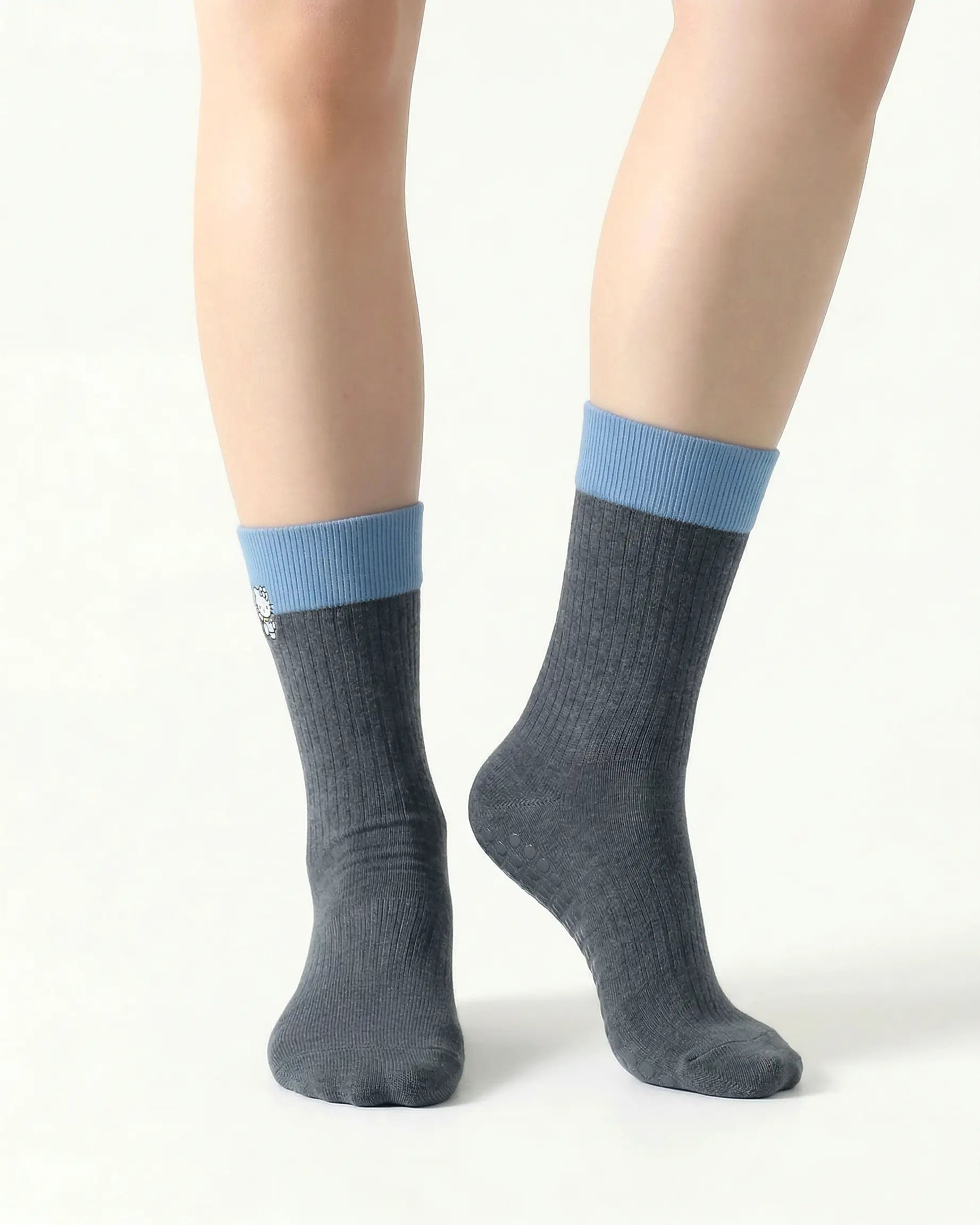 dark-grey | 04 | Dark grey character embroidery crew grip socks front standing view showing contrast cuff, ribbed knit texture, and clean non-slip crew sock shape