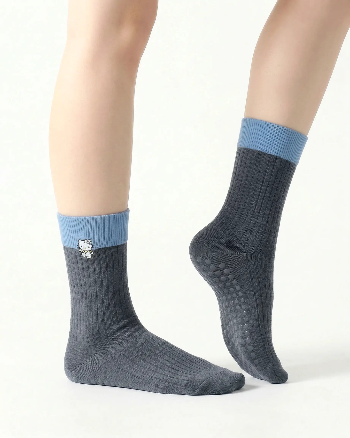 dark-grey | 03 | Dark grey character embroidery crew grip socks side pointed standing view showing contrast cuff, clean crew silhouette, and cat embroidery detail