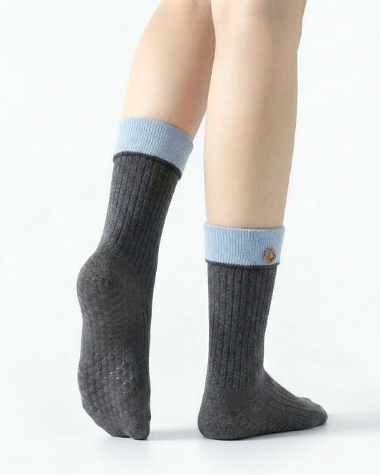 dark-grey | 02 | Dark grey floral detail crew grip socks back side view showing grip sole detail, contrast cuff, and flower embroidery on fold-over cuff
