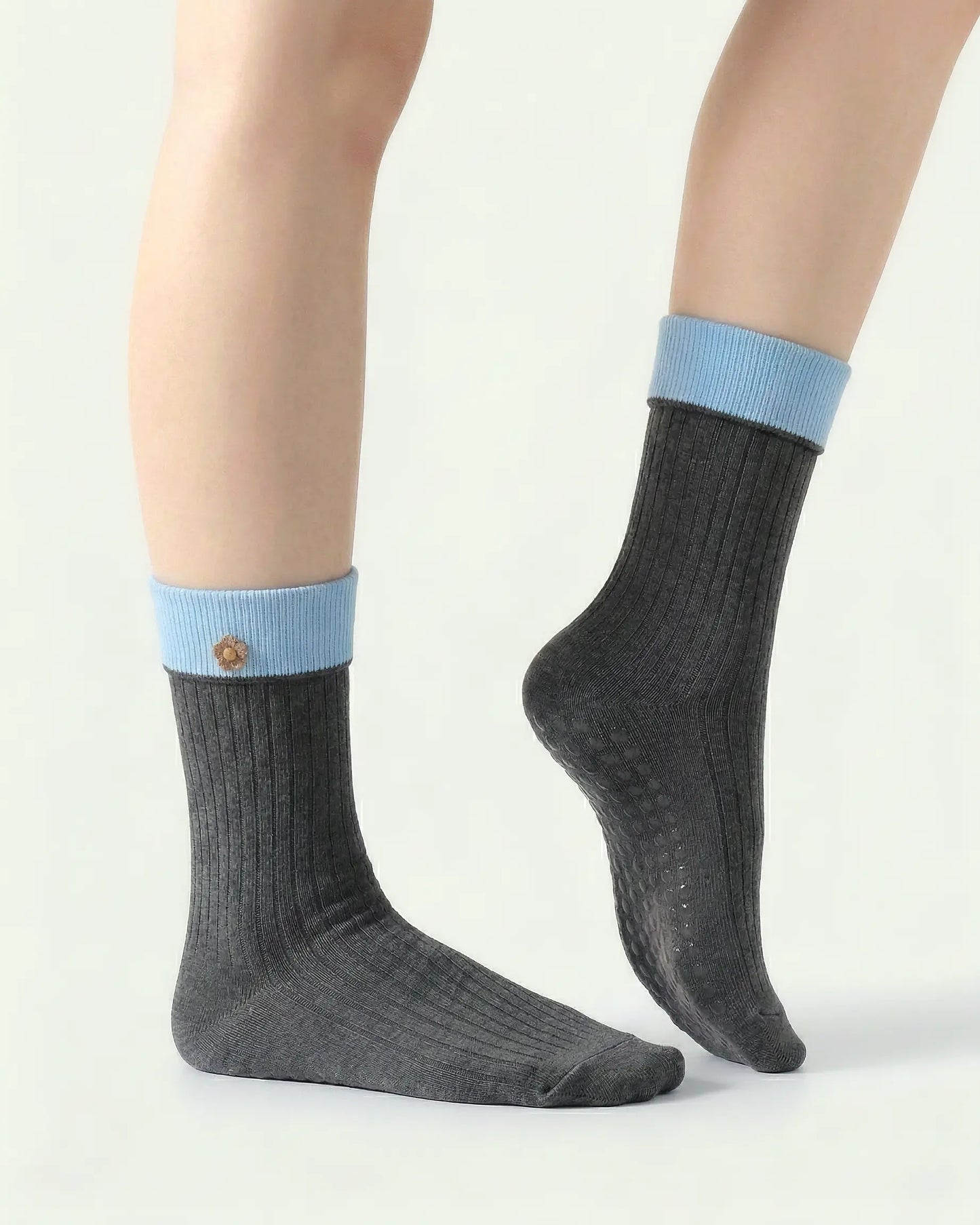 dark-grey | 03 | Dark grey floral detail crew grip socks side detail view showing fold-over contrast cuff, ribbed crew silhouette, and floral embroidery accent
