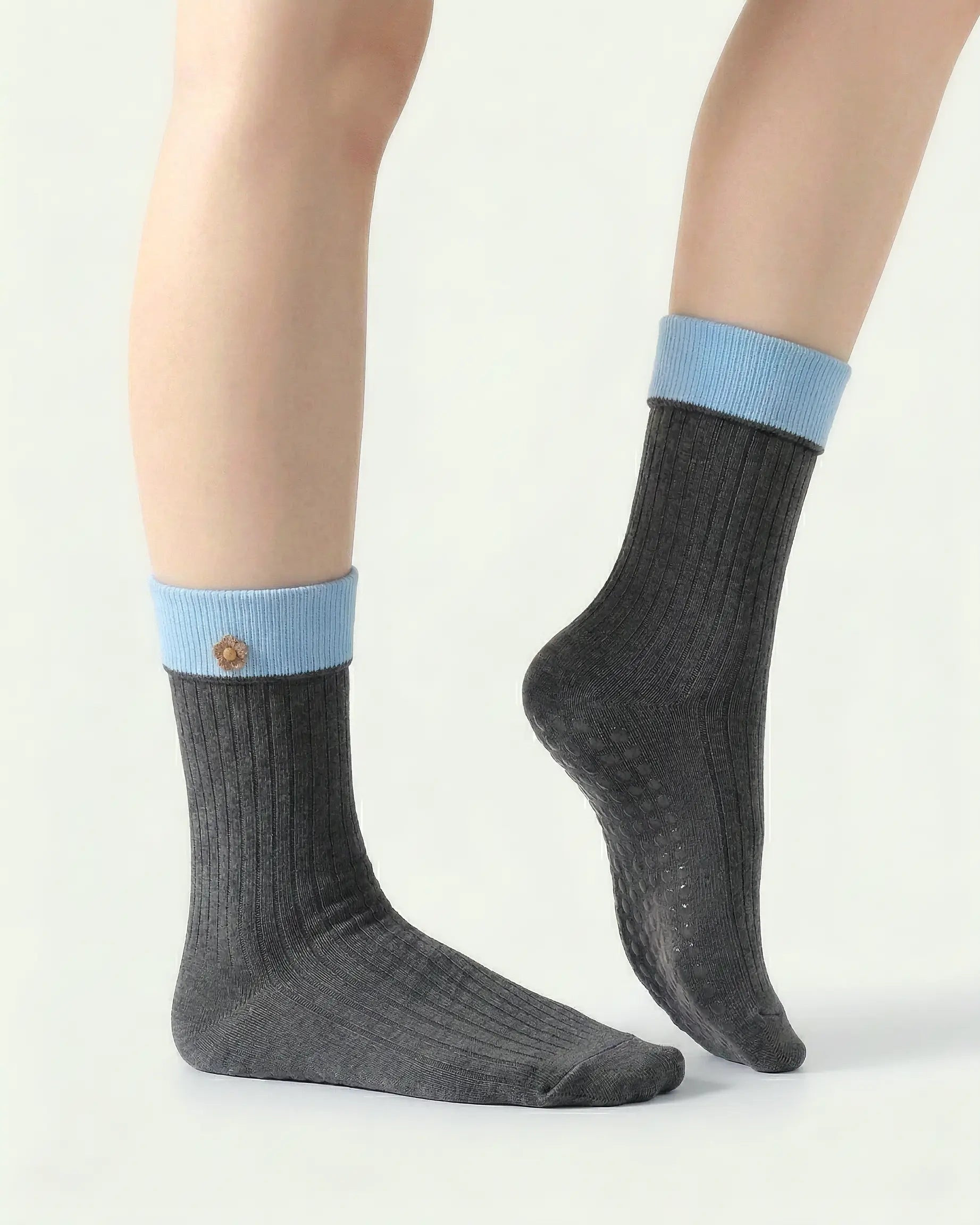 dark-grey | 03 | Dark grey floral detail crew grip socks side detail view showing fold-over contrast cuff, ribbed crew silhouette, and floral embroidery accent