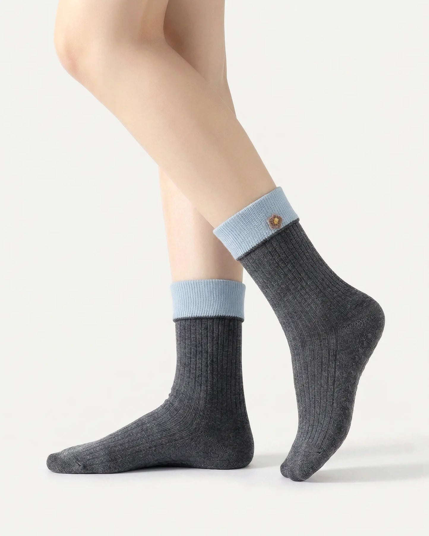 dark-grey | 01 | Dark grey floral detail crew grip socks side standing view showing contrast cuff, ribbed knit texture, and small flower embroidery detail