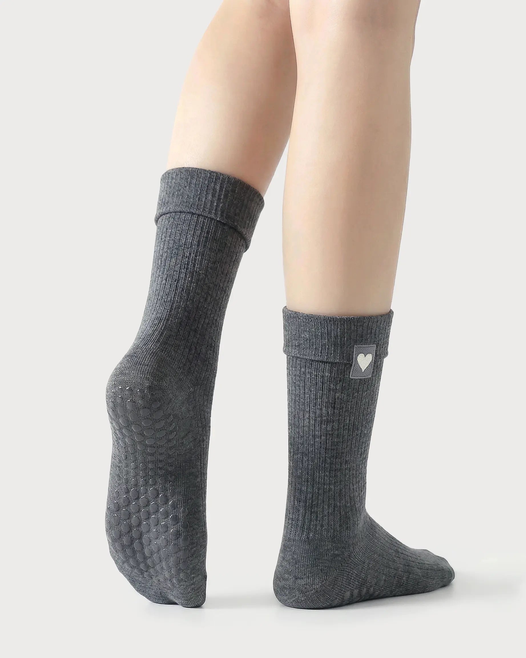dark-grey | 02 | Dark-grey heart detail crew grip socks back side view showing grip sole detail, fold-over cuff, and black heart embroidery