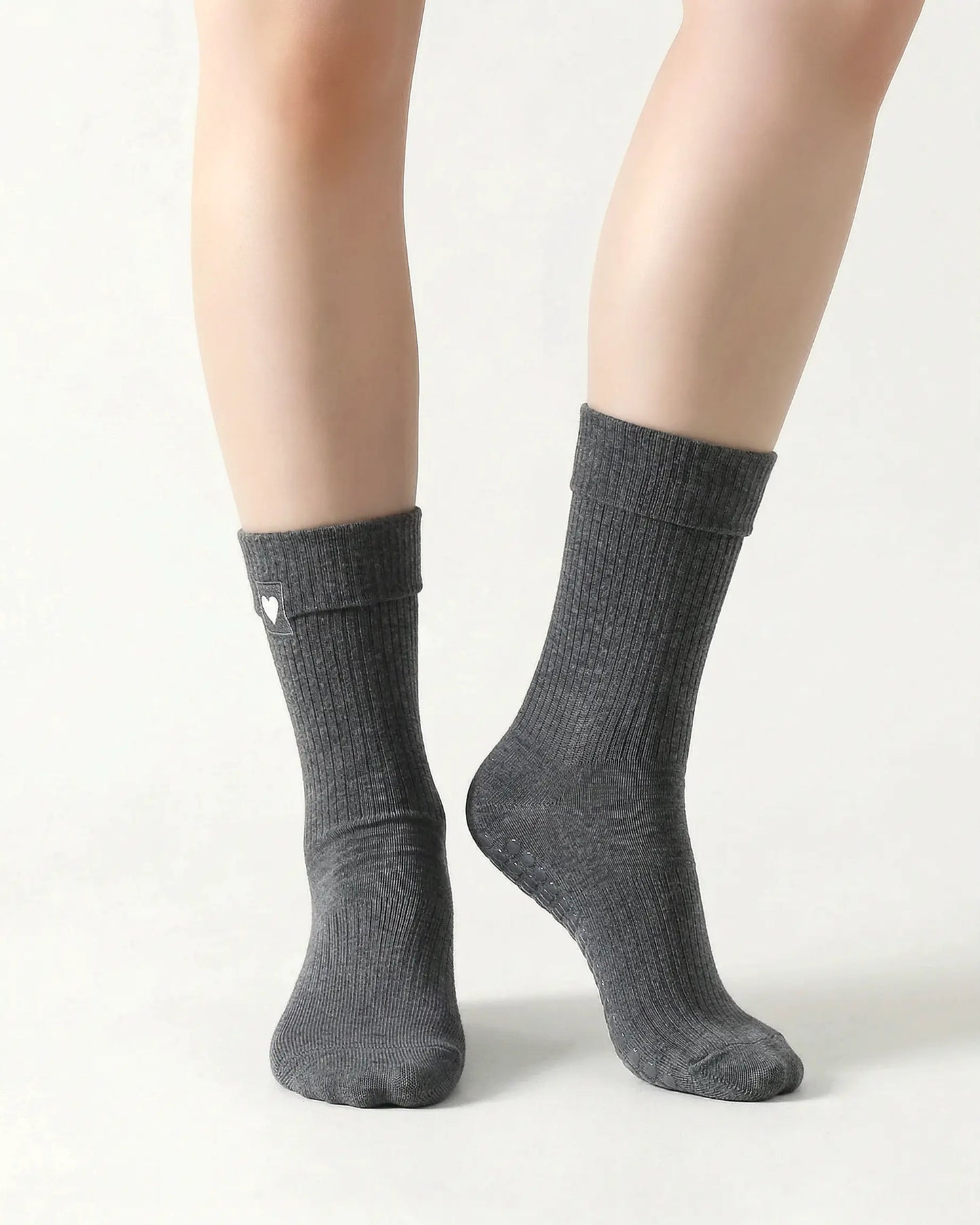 dark-grey | 04 | Dark grey heart detail crew grip socks front standing view showing fold-over cuff, black heart embroidery, and clean non-slip crew sock silhouette