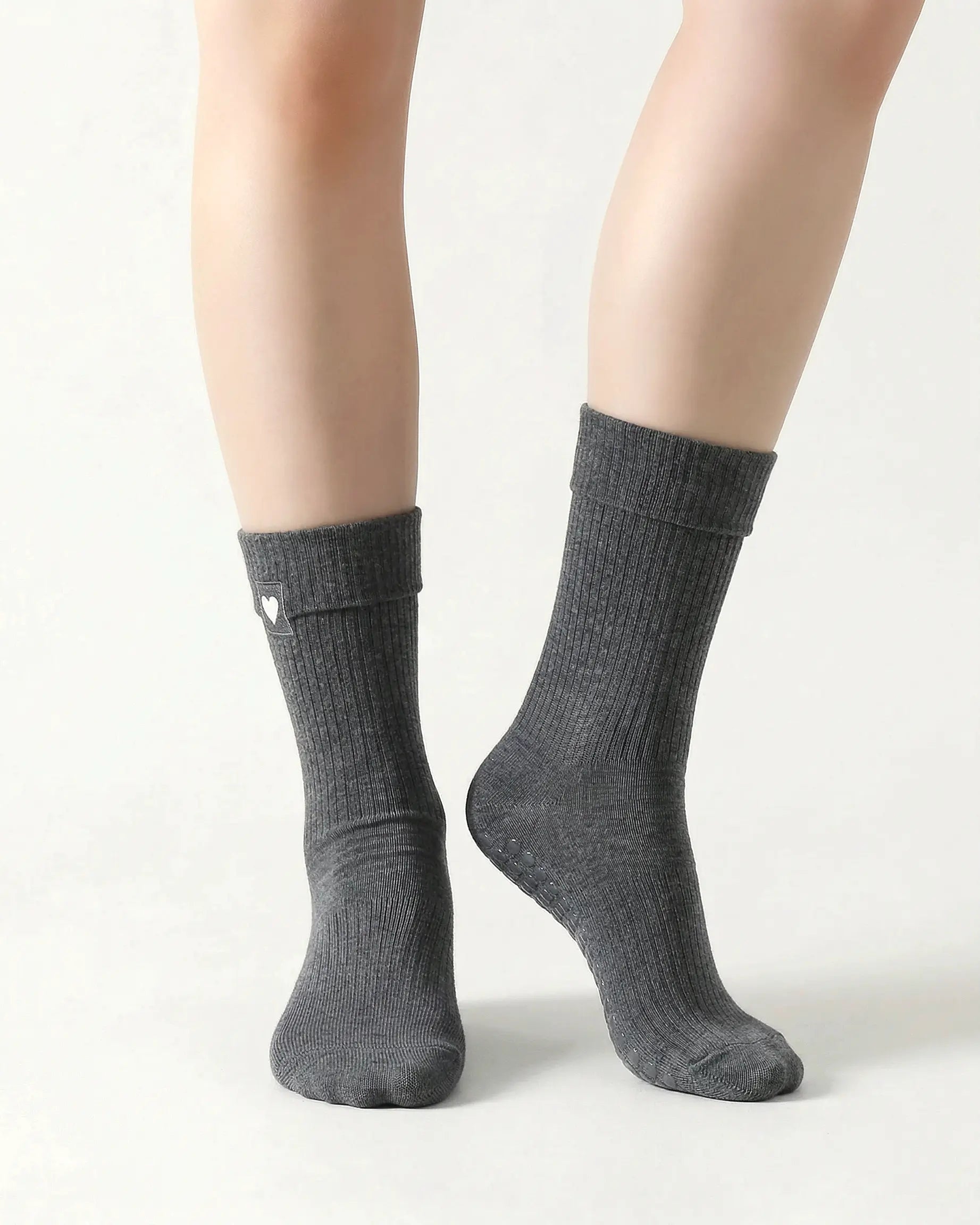 dark-grey | 04 | Dark grey heart detail crew grip socks front standing view showing fold-over cuff, black heart embroidery, and clean non-slip crew sock silhouette