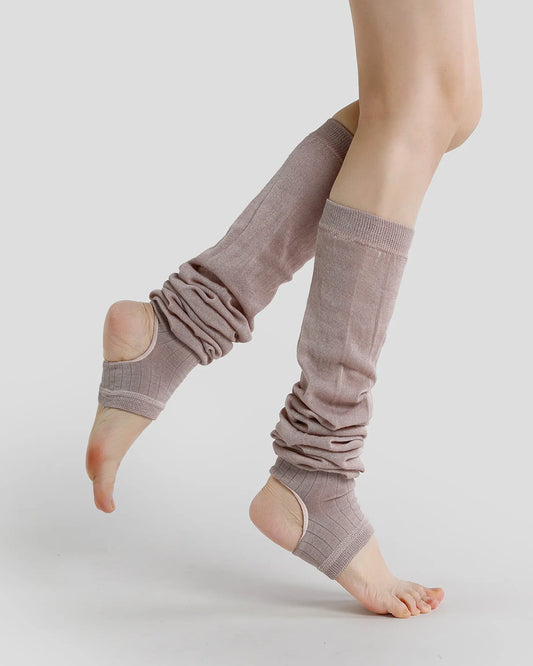 dusty-mauve | 01 | Dusty mauve ballet stirrup leg warmers side pointed pose showing the open-heel design, extended length, and soft slouch styling