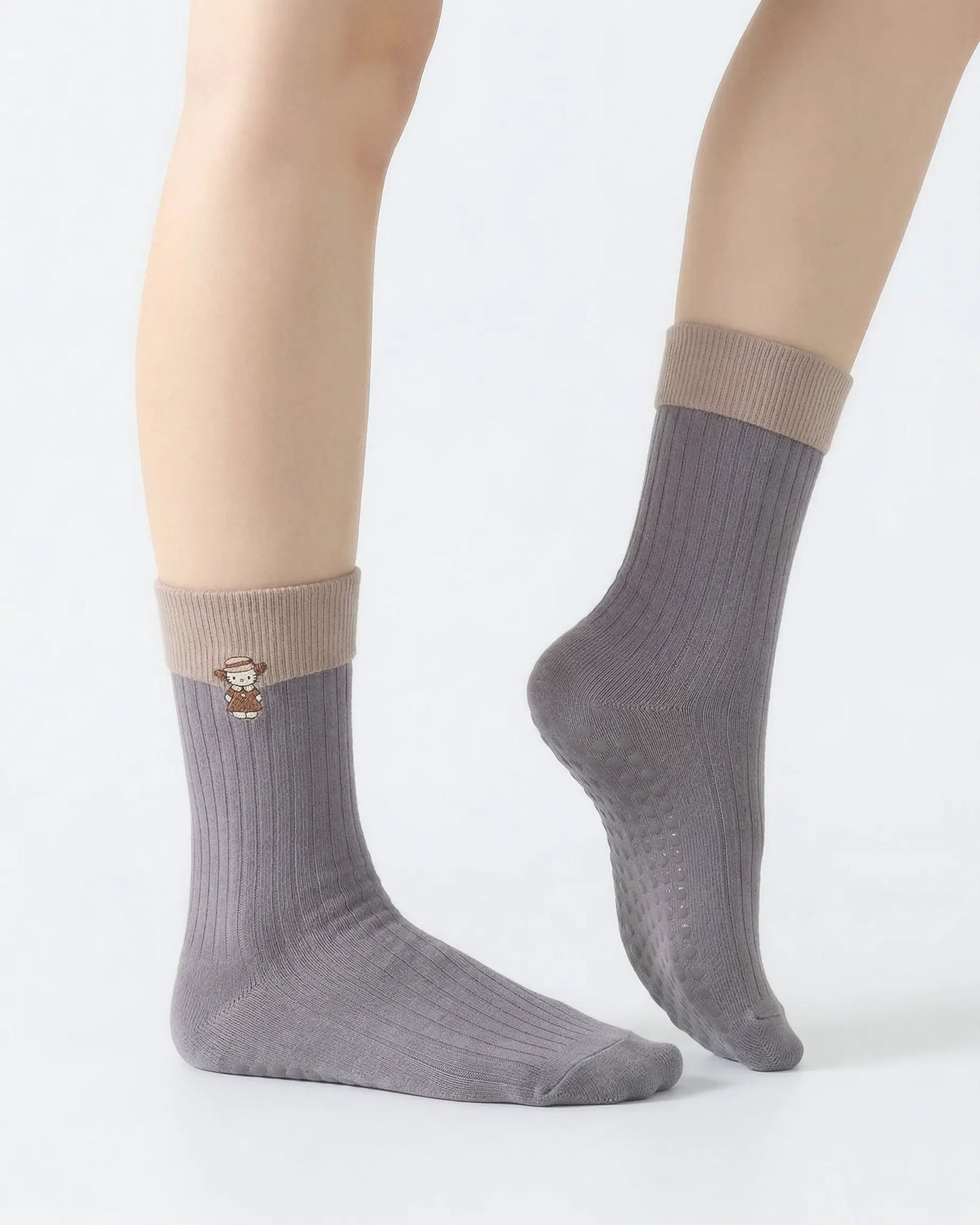 light-grey | 03 | Light grey character embroidery crew grip socks side pointed standing view showing contrast cuff, clean crew silhouette, and cat embroidery detail