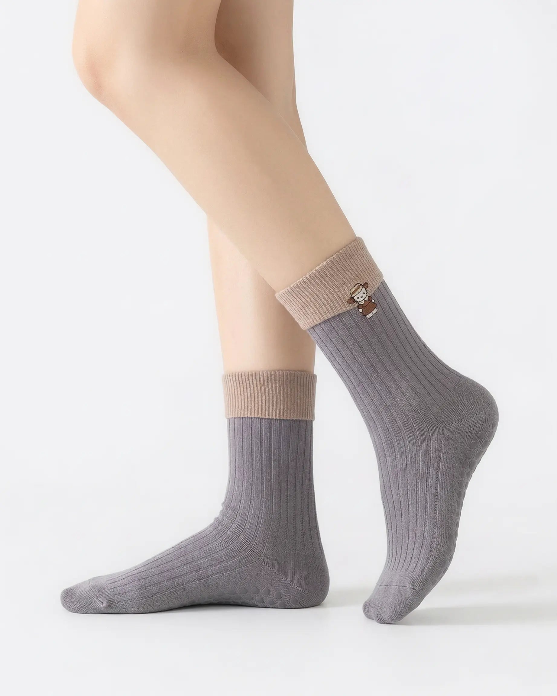 light-grey | 01 | Light grey character embroidery crew grip socks side standing view showing contrast black cuff, ribbed knit texture, and cat embroidery detail
