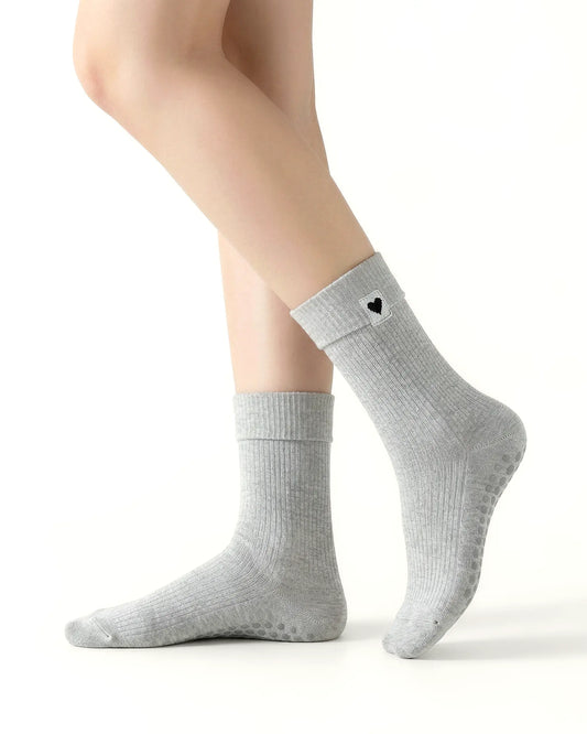 light-grey | 01 | Light-grey heart detail crew grip socks side standing view showing ribbed knit texture, fold-over cuff, and black heart embroidery