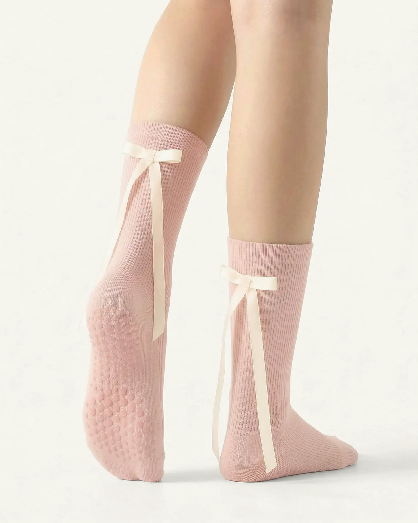 pink | 02 | Pink ballet ribbon crew grip socks back side view showing grip sole detail, ribbon bow accent, and crew coverage