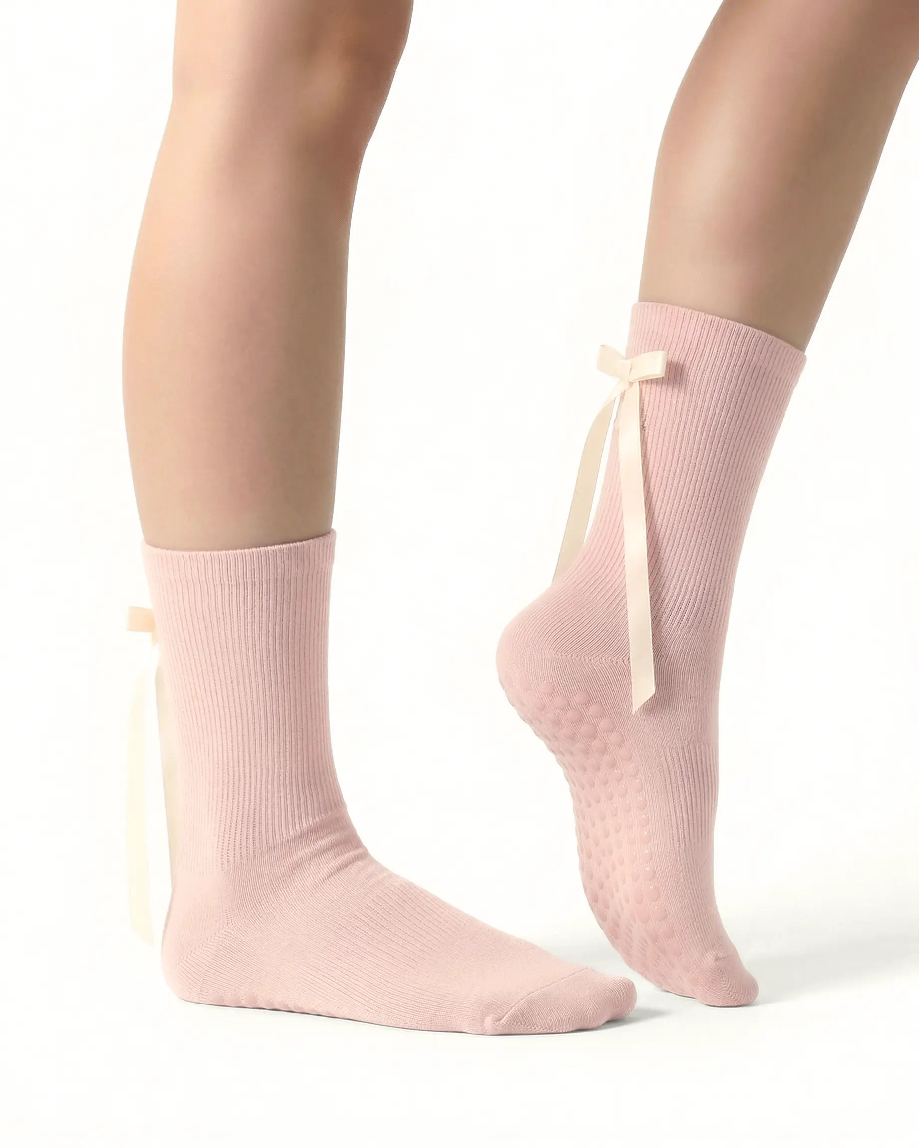 pink | 03 | Pink ballet ribbon crew grip socks side detail view showing satin ribbon bow, ribbed cuff, and ballet-inspired styling