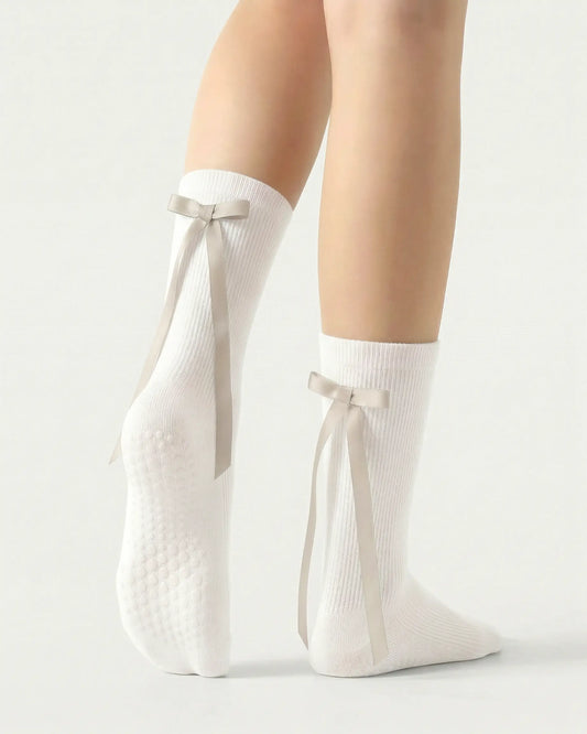 white | 02 | White ballet ribbon crew grip socks back side view showing grip sole detail, ribbon bow accent, and crew coverage
