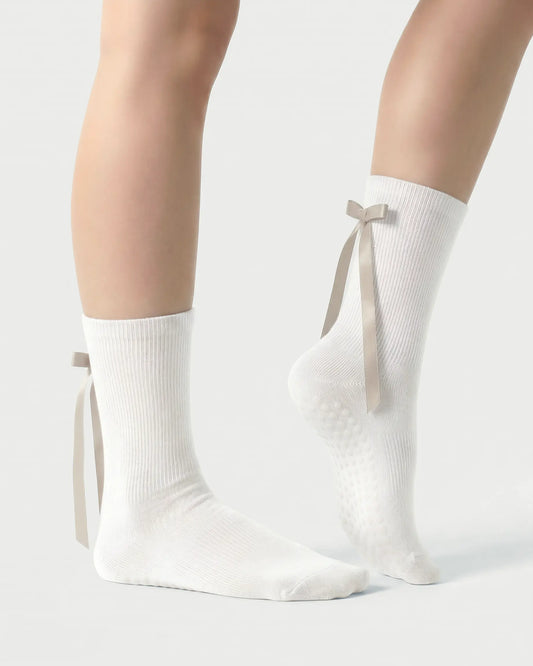 white | 03 | White ballet ribbon crew grip socks side detail view showing satin ribbon bow, ribbed cuff, and ballet-inspired styling