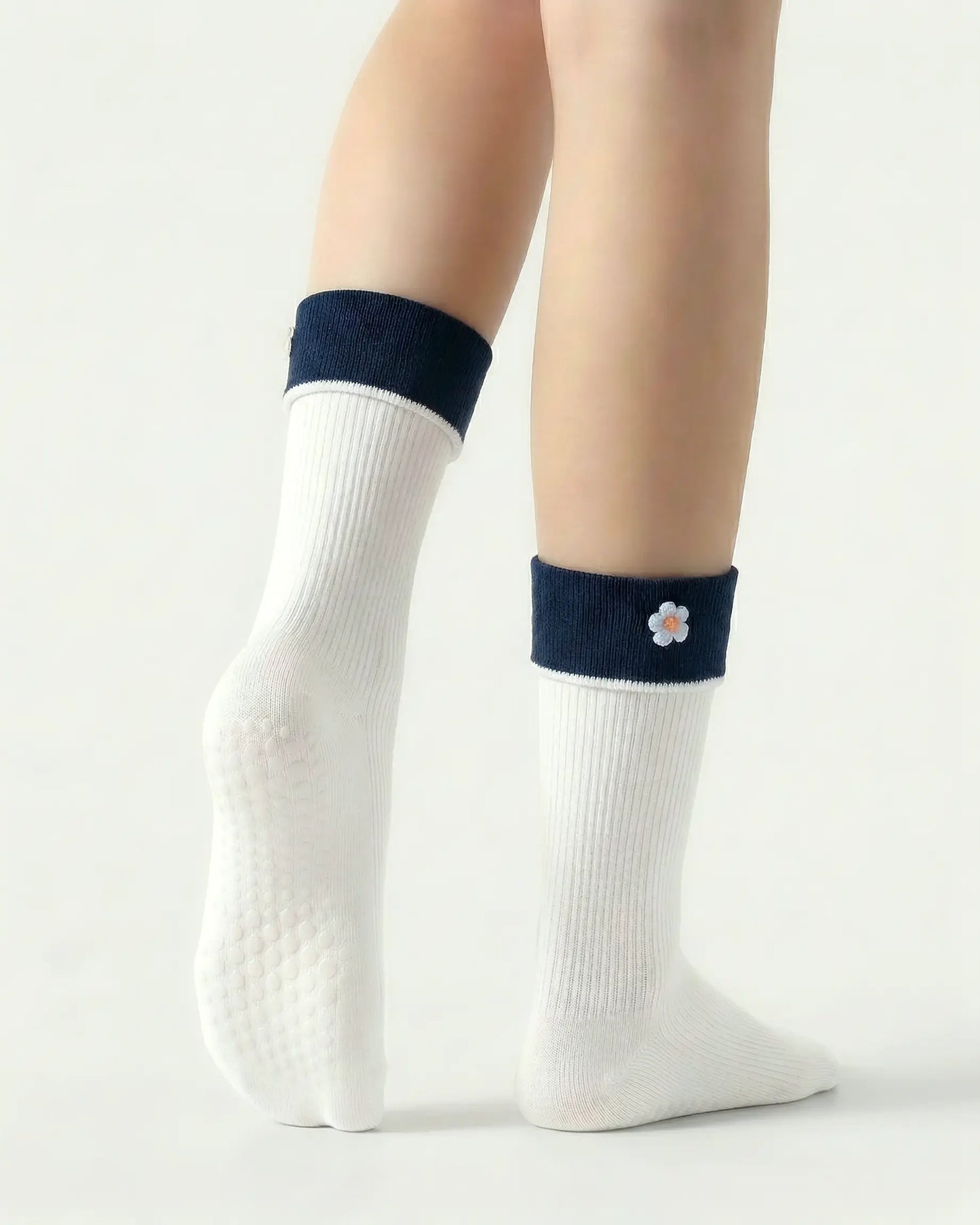 white | 02 | White floral detail crew grip socks back side view showing grip sole detail, contrast cuff, and flower embroidery on fold-over cuff