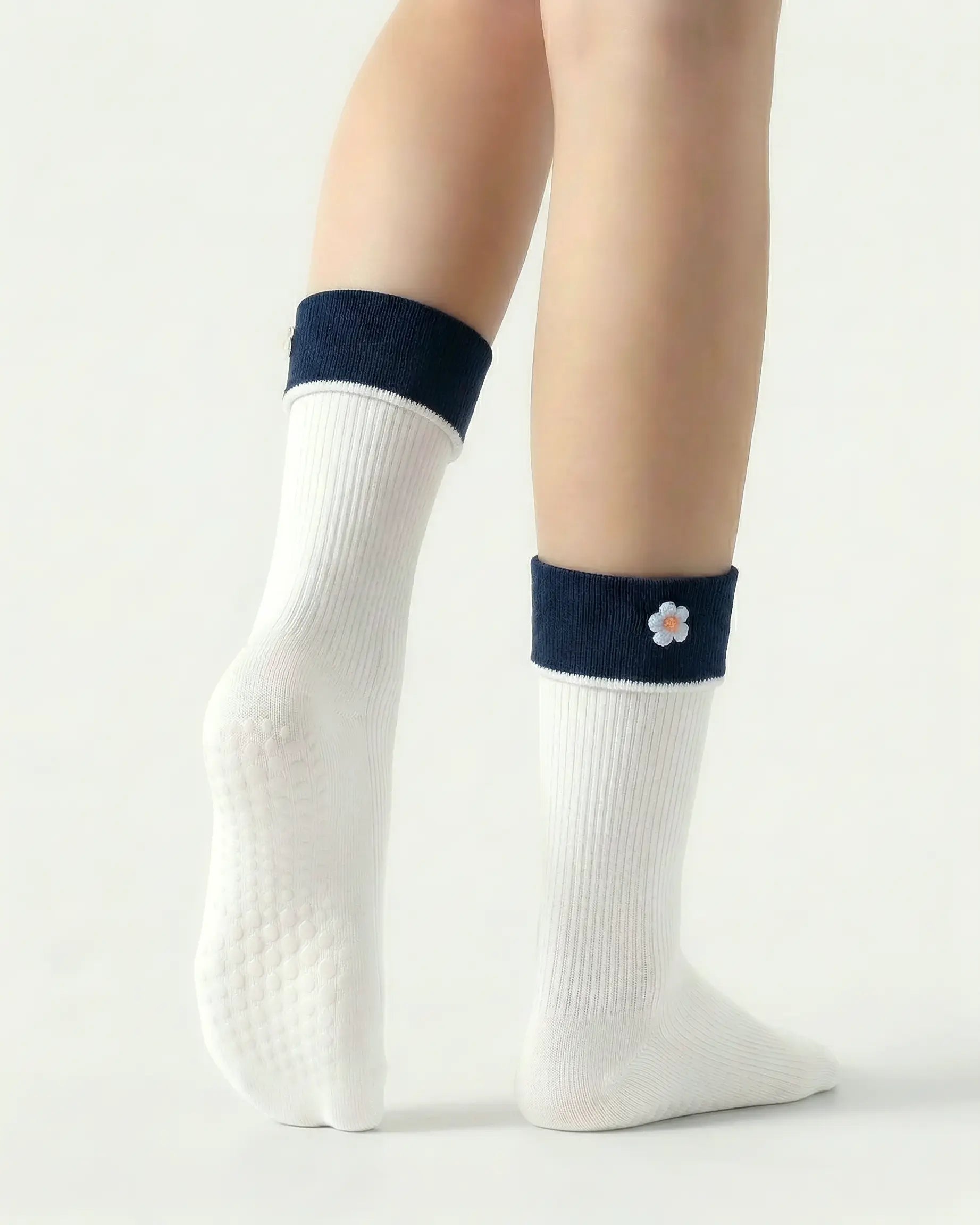 white | 02 | White floral detail crew grip socks back side view showing grip sole detail, contrast cuff, and flower embroidery on fold-over cuff