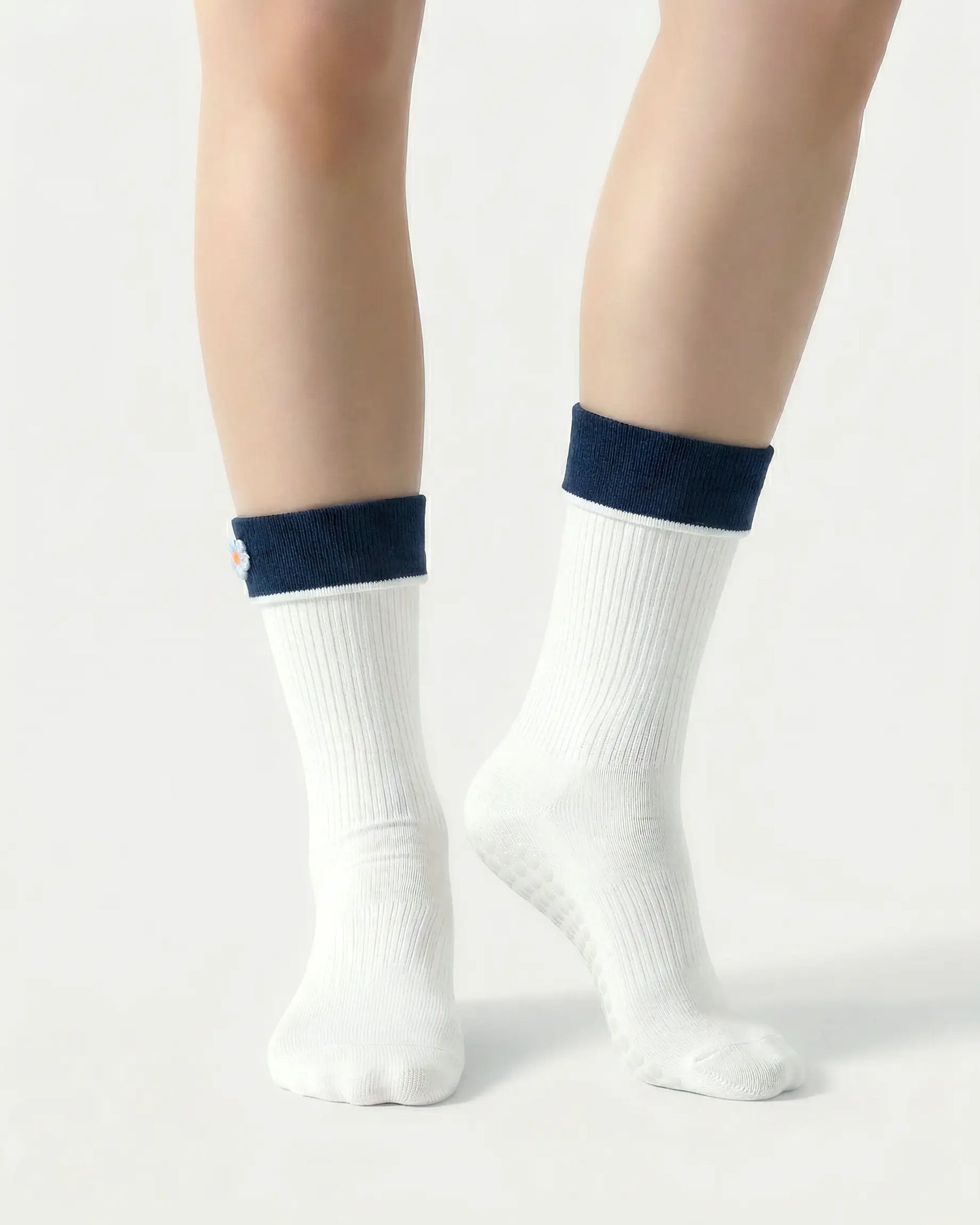 white | 04 | White floral detail crew grip socks front standing view showing clean crew shape, contrast cuff, and minimal non-slip sock styling